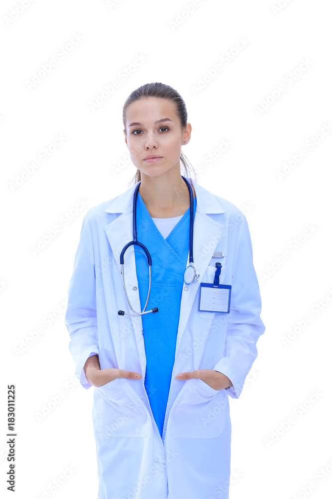 Beautiful young woman in white coat posing with hand in pocket. Woman doctor