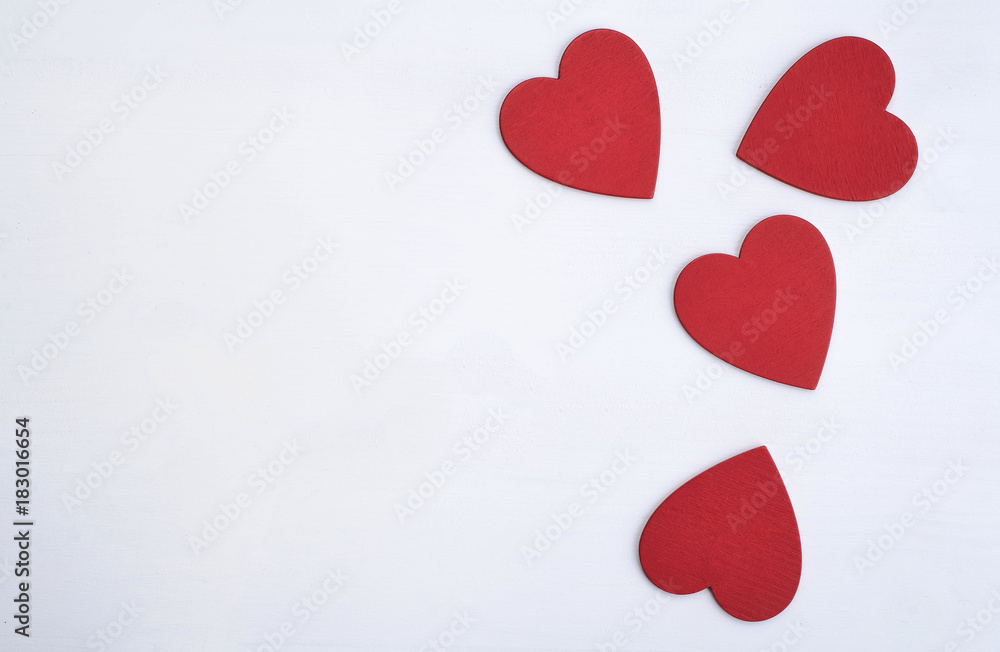 Beautiful red heart symbols on the white wood table. Beautiful red heart symbols on the white wood table.