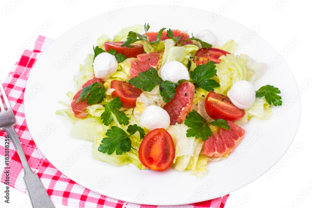Vegetarian salad from cabbage, tomatoes and grapefruit Vegetarian salad from cabbage, tomatoes and grapefruit