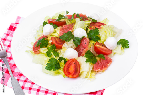 Vegetarian salad from cabbage, tomatoes and grapefruit