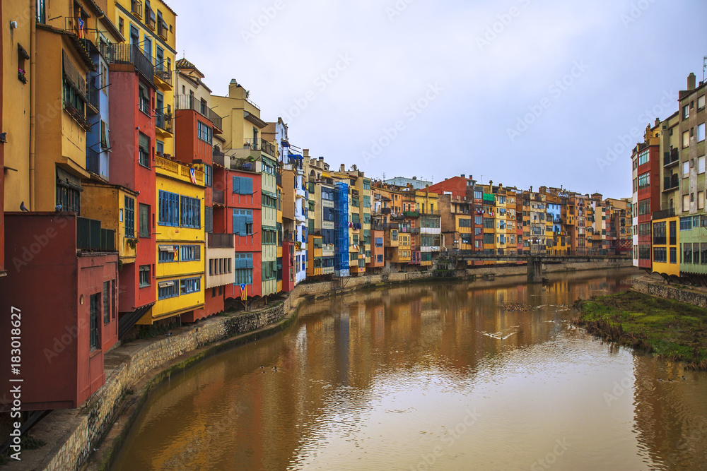 A row of colourful riverside houses