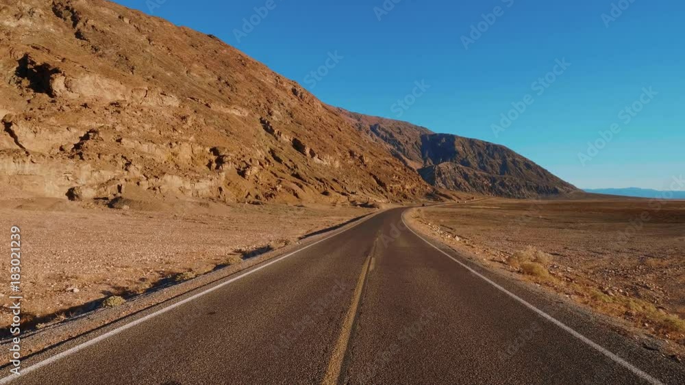 Scenery road through the amazing landscape of Death Valley National Park California Scenery road through the amazing landscape of Death Valley National Park California