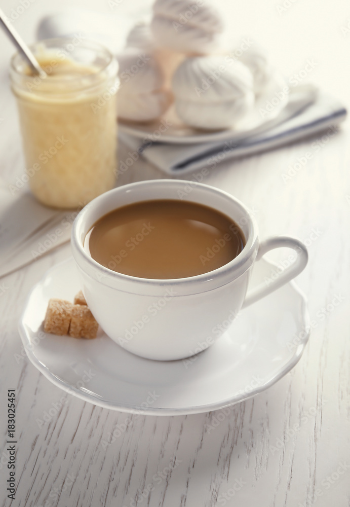 Cup with delicious coffee on table Cup with delicious coffee on table