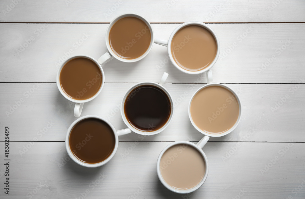 Composition with cups of delicious coffee on light background Composition with cups of delicious coffee on light background