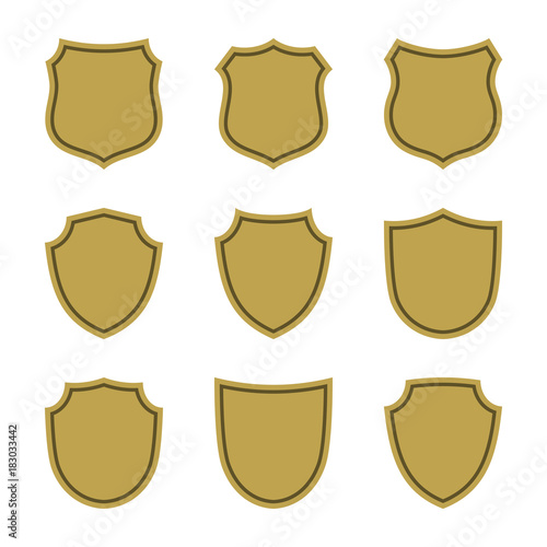 Shield shape gold icons set. Simple flat logo on white background. Symbol of security, protection, safety, strong. Element badge for protect design emblem decoration. Vector illustration