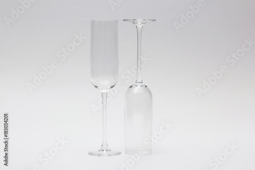 two empty wine glass on a light background.