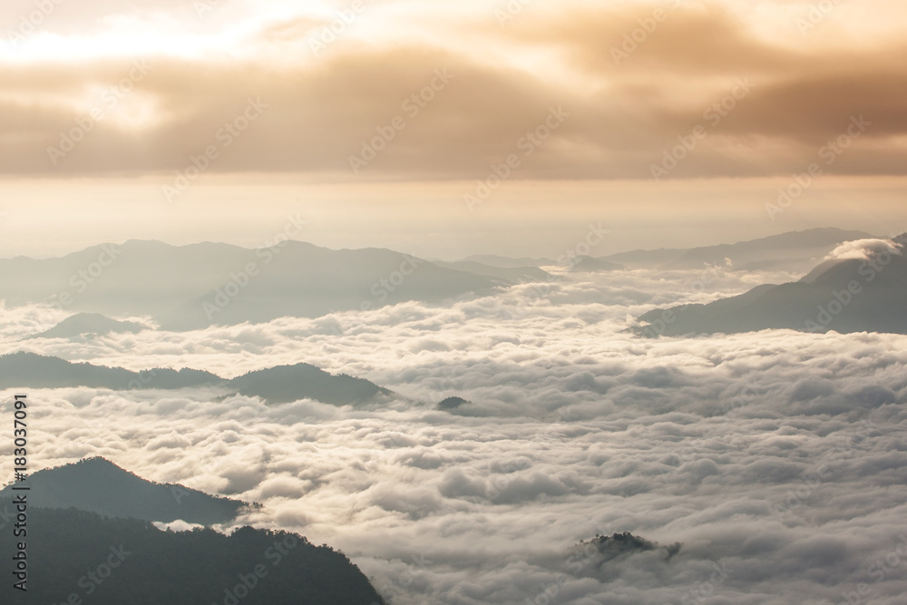 Beautiful landscape of mountain layer in morning sun ray and winter fog at Phu chi fa national forest park in ,Chiang Rai, Thailand