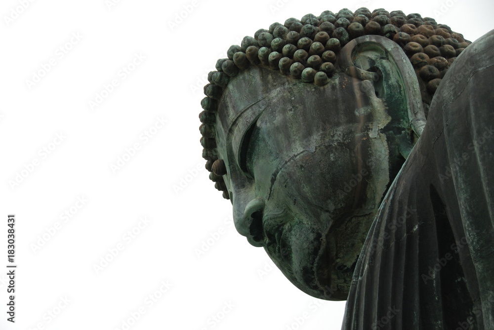 A head of Great Buddha statue at Kotoku-in Temple in Kamakura, one of the largest bronze Buddha in Japan