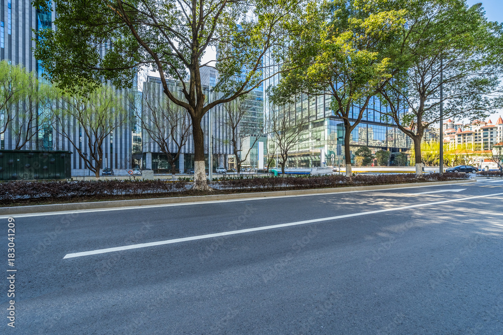empty asphalt road front of modern buildings. empty asphalt road front of modern buildings.