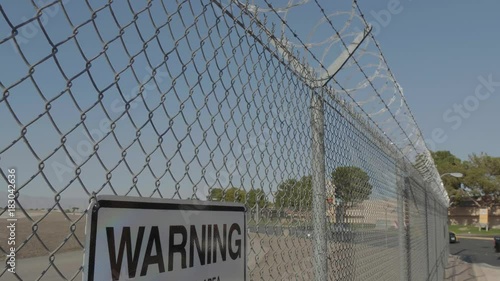 Barb wire on the top of a fence