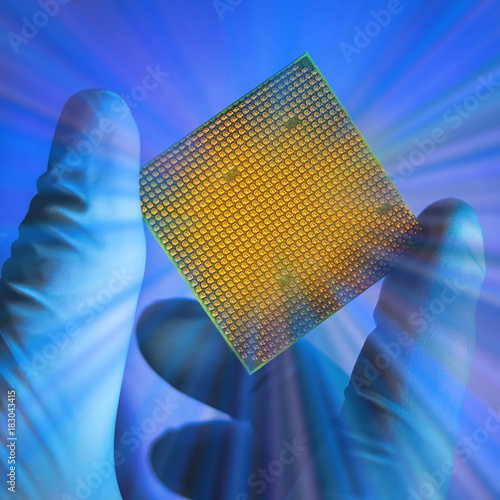 processor on the hand in the glove. cpu. rays.