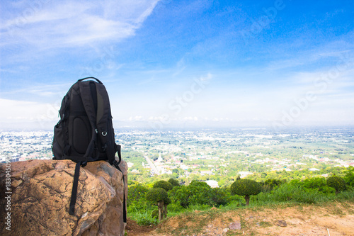 black backpack for traveler on the stone