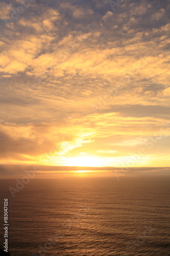 Sunset in pacific ocean, near CA route 1 © Purplexsu