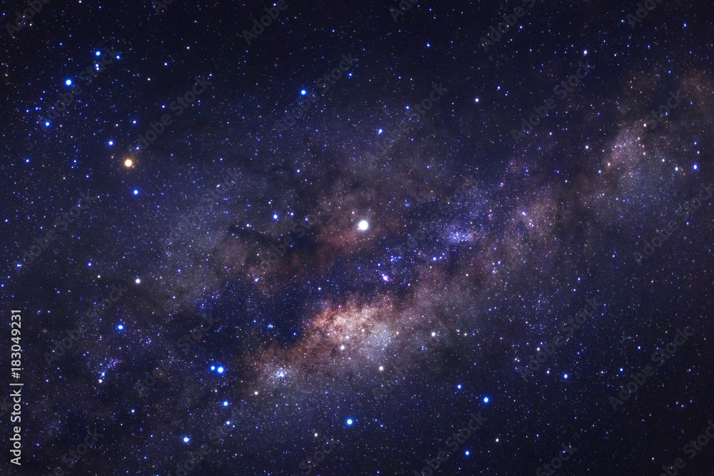 Naklejka premium Milky way galaxy with stars and space dust in the universe, Long exposure photograph, with grain.