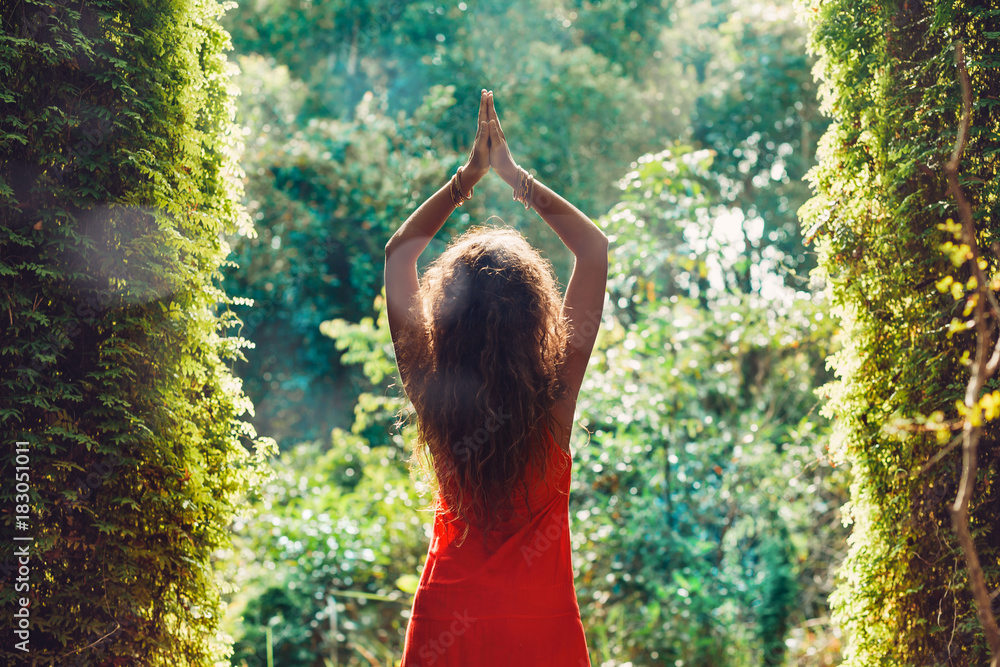 Obraz premium attractive young woman in red dress in forest