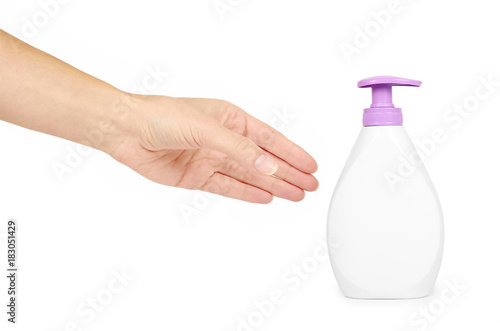 White hand sanitizer soap dispenser in hand isolated on white background. Housework and sanitary concept