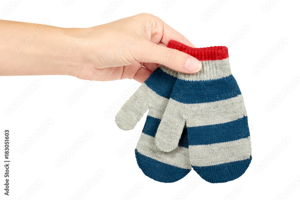 Warm winter children's gloves in hand isolated on white background. Sale and buy Warm winter children's gloves in hand isolated on white background. Sale and buy