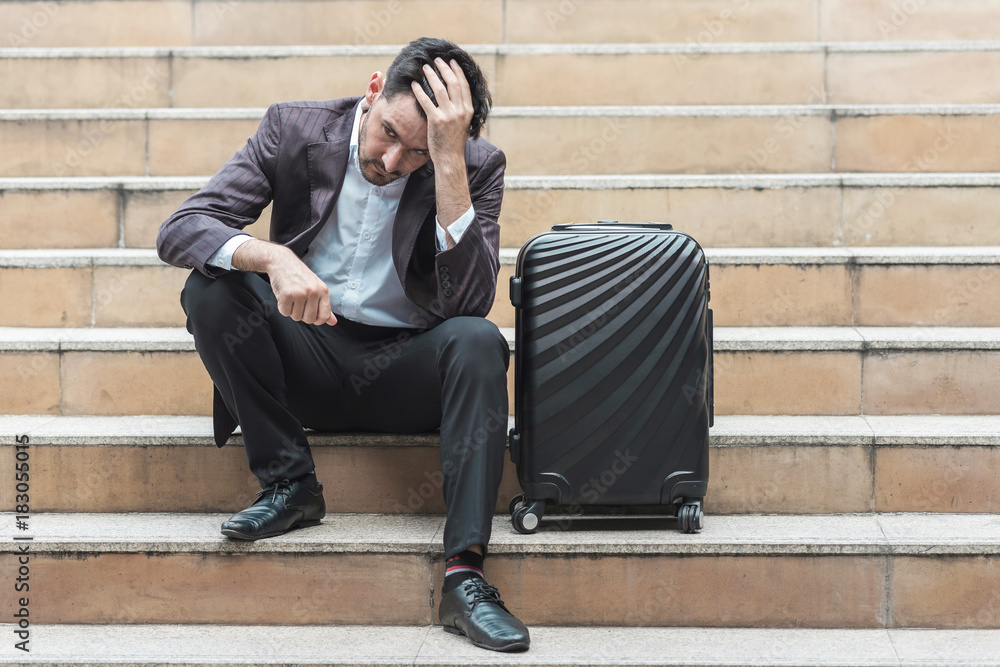 Stress out handsome white male business man or sale man sitting on stair. Stress out handsome white male business man or sale man sitting on stair.