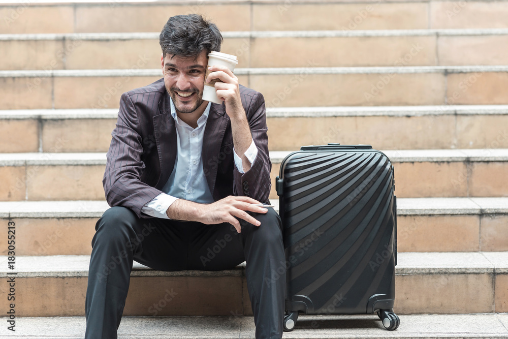 happy handsome white male business man or sale man sitting on stair. happy handsome white male business man or sale man sitting on stair.