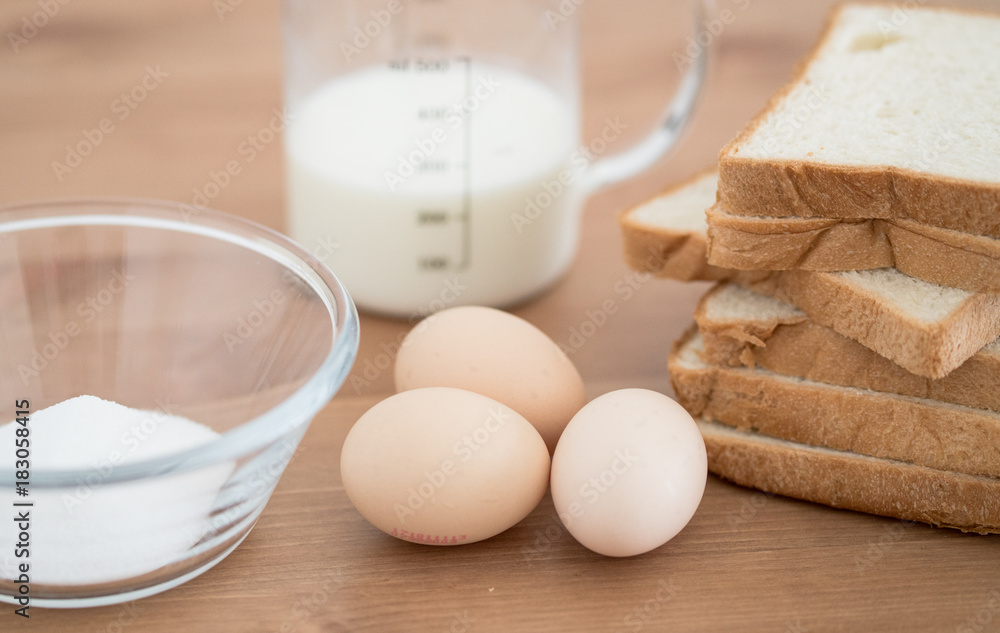 All Ingredients for french toast preparation eggs milk bread and sugar All Ingredients for french toast preparation eggs milk bread and sugar