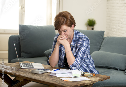 Obraz na plátně young sad worried and desperate woman banking and accounting home monthly and cr