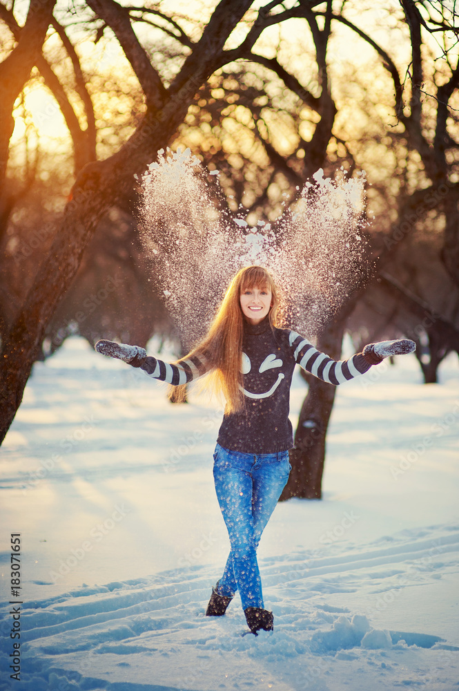Beautiful girl in a beautiful day winter snow park Beautiful girl in a beautiful day winter snow park