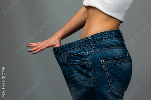 Woman trying jeans
