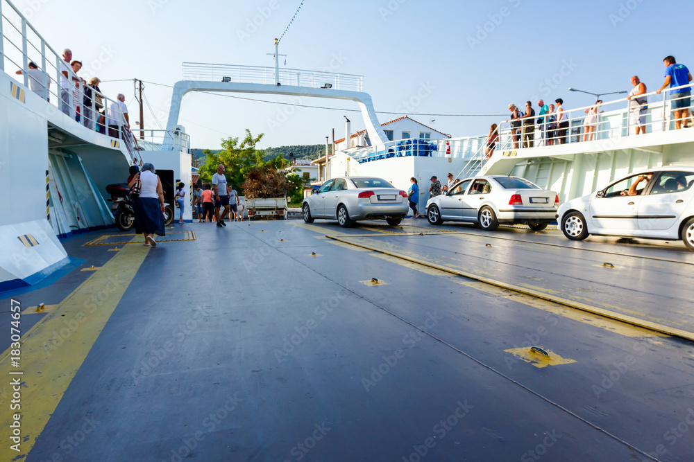 Naklejka premium Cars, people and truck are exit from ferryboat, unloading