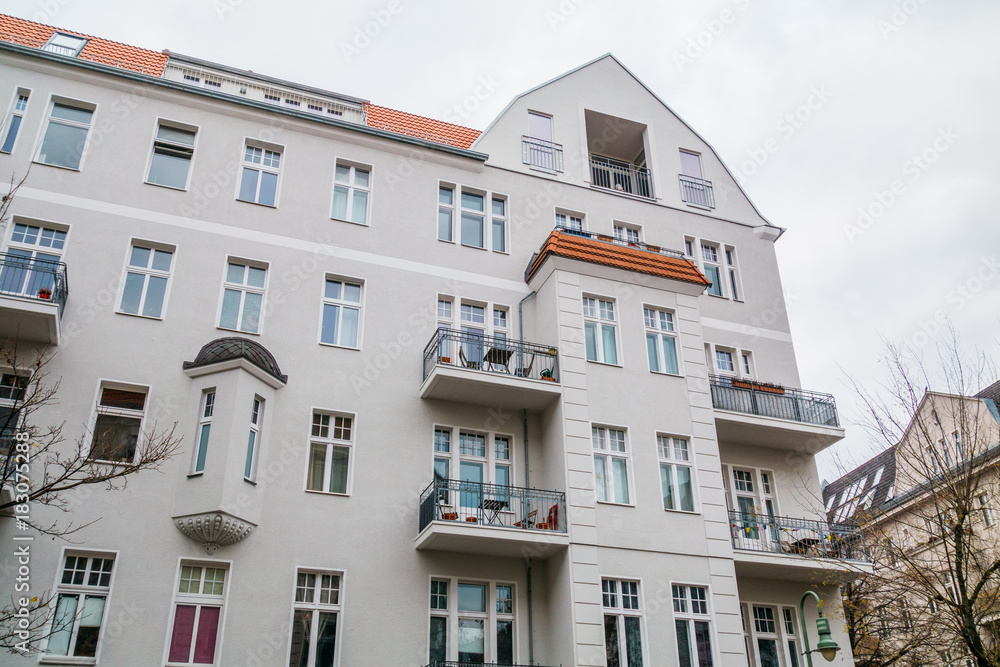 typical building in berlin, friedrichshain with grey facade typical building in berlin, friedrichshain with grey facade