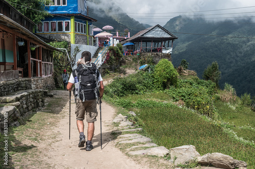 Tourist hikes on Annapurna trekking trail.