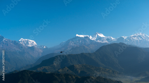 Helicopter flying among mountains, Pokhara, Nepal.