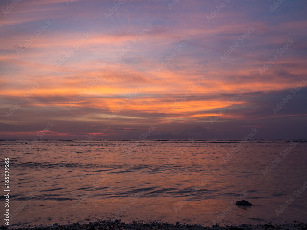 Beautiful sunset on a tropical beach in Gili, Indonesia. November, 2017 Beautiful sunset on a tropical beach in Gili, Indonesia. November, 2017