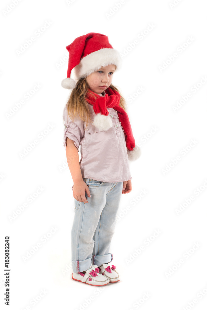 the serious girl in Santa Claus's cap stands. the serious girl in Santa Claus's cap stands.