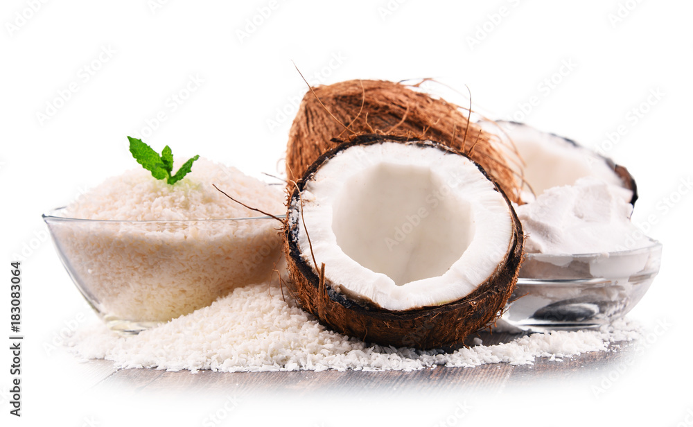 Composition with shredded coconut and shells isolated on white Composition with shredded coconut and shells isolated on white