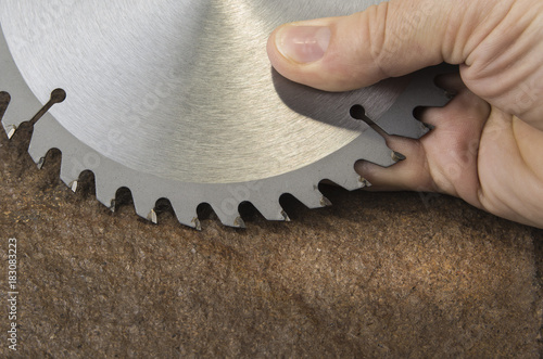 Circular saw blade for wood work on the stone background
