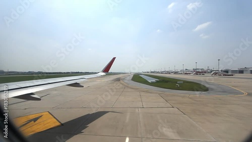 Plane moving in airport, View from the plane window photo