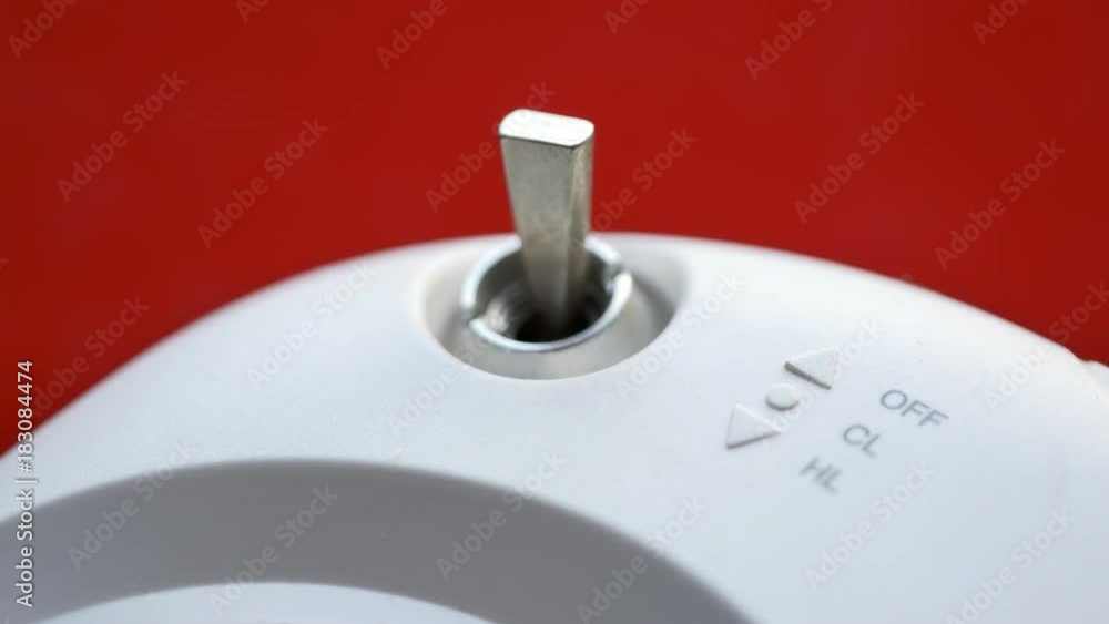Hand turning the radio control switch on and off. Mini lever metal ...