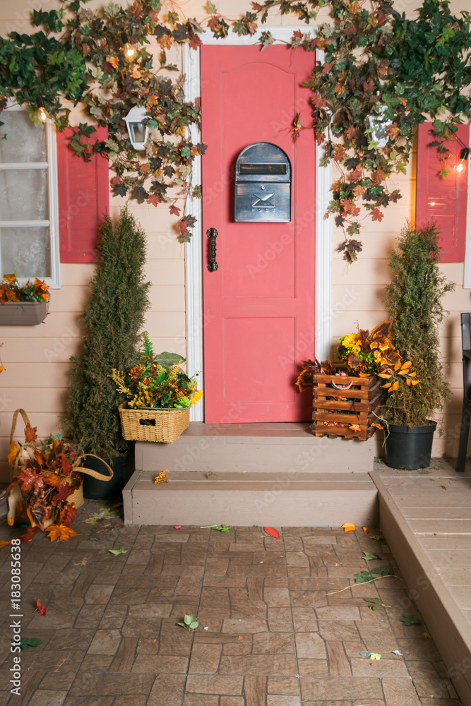 The fall of the house with autumn decorations