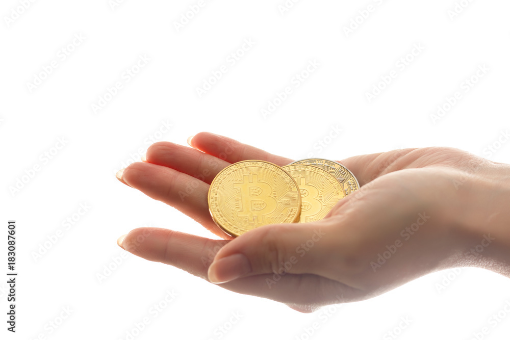 hand holds three coins of digital currency bitcoin