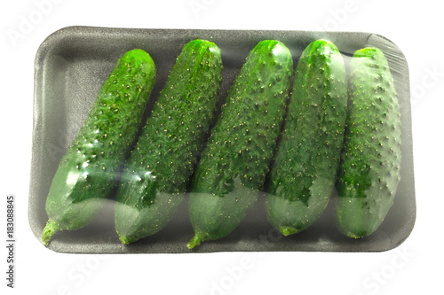 The packing of fresh cucumbers without label isolated on a white background with clipping path.