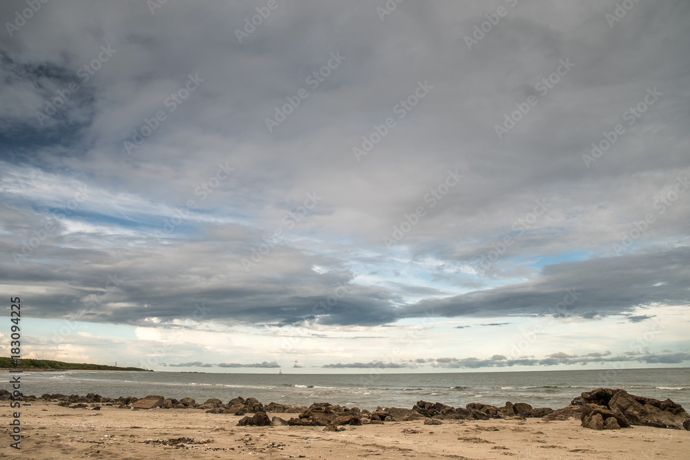 Beautiful scenic landscape with dramatic cloudy sky at sunset