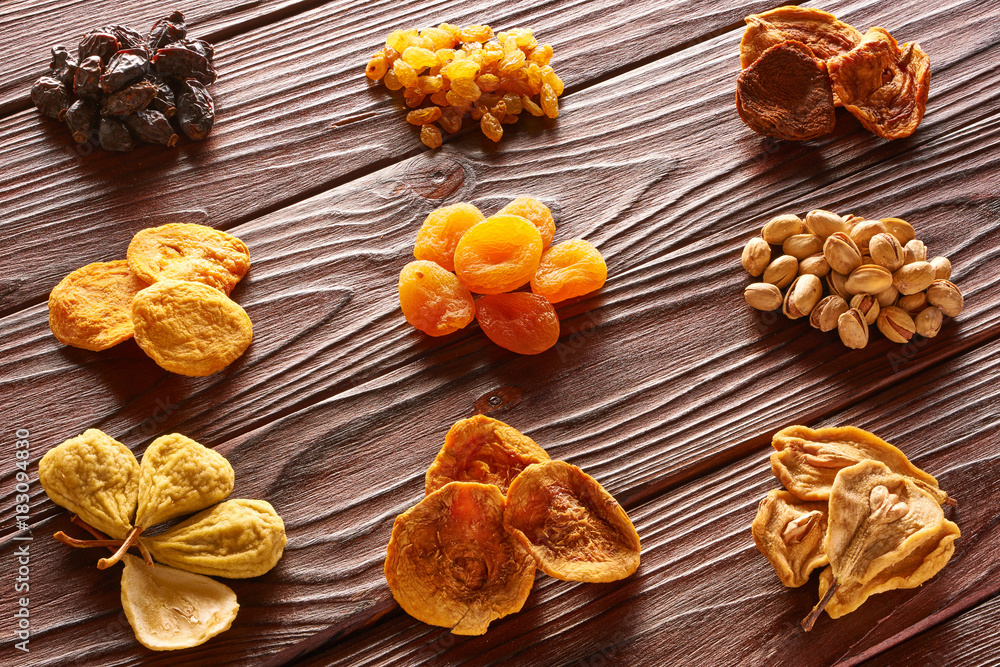 Dried fruits and nuts on wooden background Dried fruits and nuts on wooden background