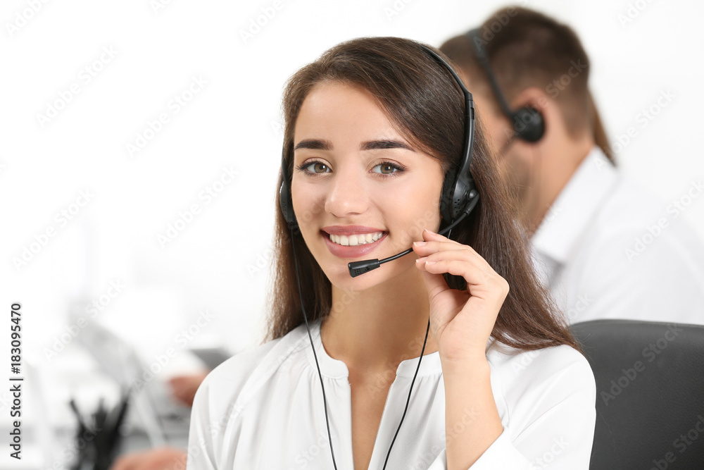 Female consulting manager with headset in office Female consulting manager with headset in office
