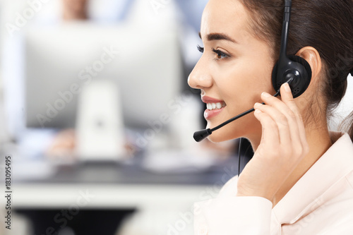 Female consulting manager with headset in office