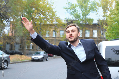 Young businessman catching ...
