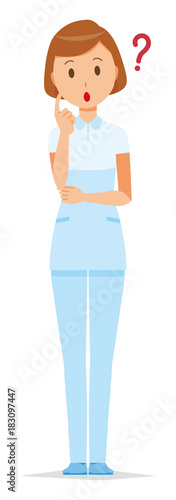 A female nurse wearing a white uniform thinks