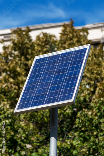 Solar panel supplies street sign and lighting in the city - alternative electricity source
