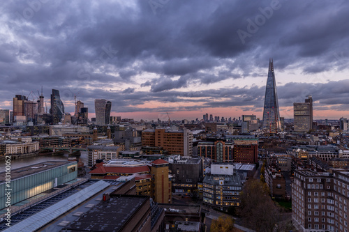 Photography Aerial cityscape view of rooftops on modern London skyline at sunset