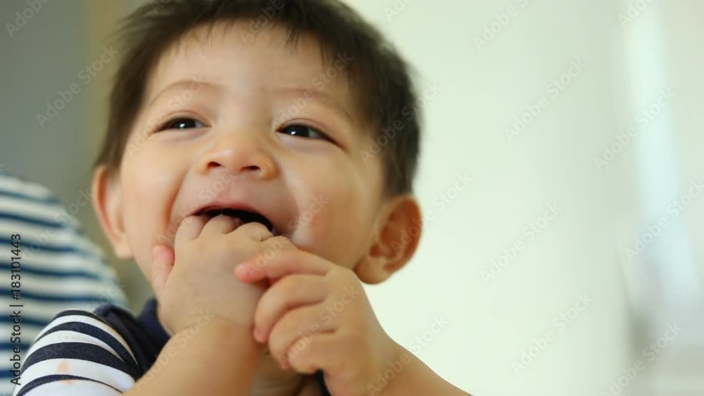 cute baby boy using finger hand in mouth itchy gum, slow motion scene cute baby boy using finger hand in mouth itchy gum, slow motion scene