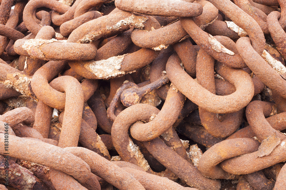 Rows of rusted chains against a background Rows of rusted chains against a background